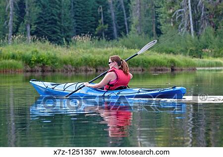 Man kayaking on the North Fork of the Payette River near Payette Lake and the city of McCall in the Salmon River Mountains of central Idaho View Large Photo Image Stock Photo - Man kayaking on the North Fork of the Payette River near Payette Lake and the city of McCall in the Salmon River Mountains of central Idaho. Fotosearch