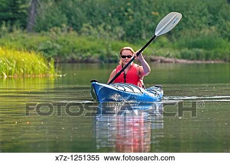 Man kayaking on the North Fork of the Payette River near Payette Lake and the city of McCall in the Salmon River Mountains of central Idaho View Large Photo Image Stock Photography - Man kayaking on the North Fork of the Payette River near Payette Lake and the city of McCall in the Salmon River Mountains of central Idaho. Fotosearch