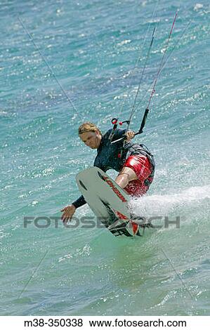 Man kiteboarding in Kauai. USA View Large Photo Image Stock Photo - Man kiteboarding in Kauai. USA. Fotosearch