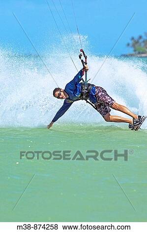 Man kiteboarding in Maui, Hawaii View Large Photo Image Stock Photo - Man kiteboarding in Maui, Hawaii. Fotosearch
