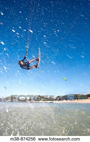 Man kiteboarding in Maui, Hawaii View Large Photo Image Stock Photograph - Man kiteboarding in Maui, Hawaii. Fotosearch