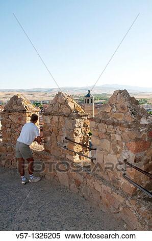 Man leaning on the banister at the City Wall viewpoint.? vila, Castilla Le? n, Spain. View Large Photo Image Stock Photography - Man leaning on the banister at the City Wall viewpoint.? vila, Castilla Le? n, Spain.. Fotosearch