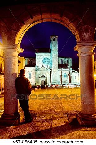 Man leant against a column looking at the Main Square and the cathedral, night view. Sig? enza, Guadalajara province, Castilla La Mancha, Spain. View Large Photo Image Stock Photography - Man leant against a column looking at the Main Square and the cathedral, night view. Sig? enza, Guadalajara province, Castilla La Mancha, Spain.. Fotosearch