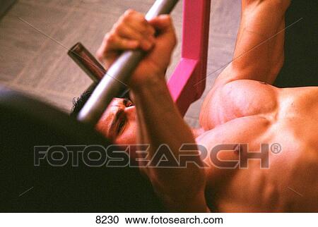 Man lifting barbells View Large Photo Image Stock Image - Man lifting barbells. Fotosearch
