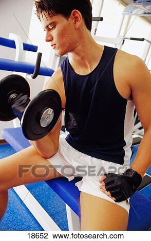 Man lifting weights View Large Photo Image Stock Image - Man lifting weights. Fotosearch