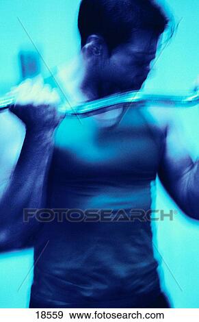 Stock Photo - Man lifting weights. Fotosearch
