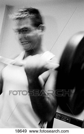 Man lifting weights View Large Photo Image Stock Photo - Man lifting weights. Fotosearch