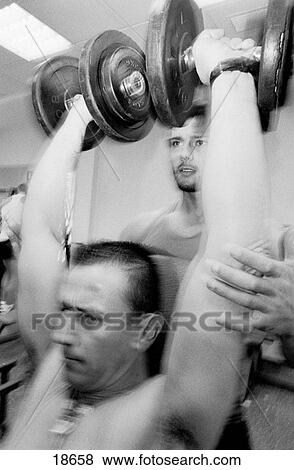 Man lifting weights View Large Photo Image Stock Photo - Man lifting weights. Fotosearch