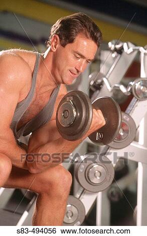 Man lifting weights View Large Photo Image Stock Photograph - Man lifting weights. Fotosearch