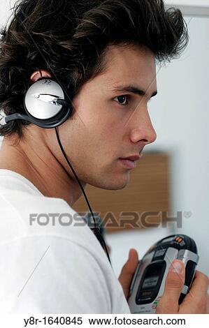 man listening to music View Large Photo Image Stock Photography - man listening to music. Fotosearch