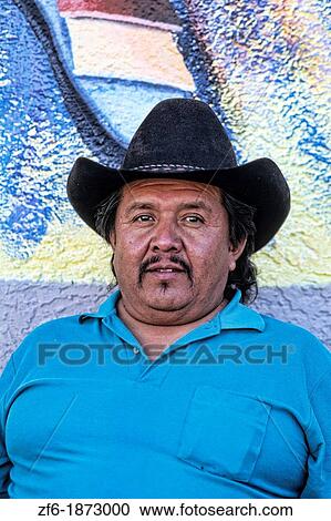 Stock Image - Man local with cowboy hat in portrait in San Miguel de Allende Mexico. Fotosearch
