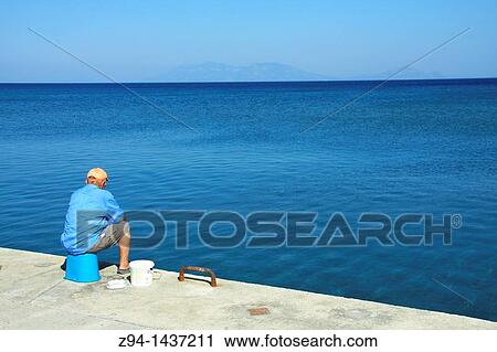 Man looking at sea View Large Photo Image Stock Image - Man looking at sea. Fotosearch