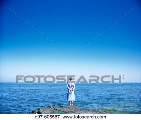 Stock Photo - Man looking at the sea. Fotosearch
