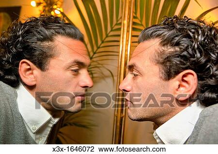 Man looking in the mirror View Large Photo Image Stock Image - Man looking in the mirror. Fotosearch