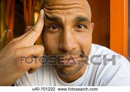 Stock Image - Man looking into camera. Fotosearch