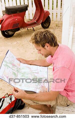 Man looking up in a map View Large Photo Image Stock Image - Man looking up in a map. Fotosearch