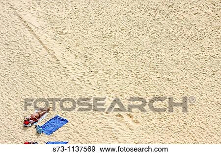 Man lying inAlbufeira beach, Algarve, Portugal View Large Photo Image Stock Photo - Man lying inAlbufeira beach, Algarve, Portugal. Fotosearch