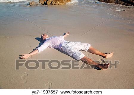 Man Lying on Beach View Large Photo Image Stock Photo - Man Lying on Beach. Fotosearch