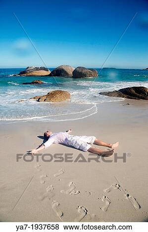 Man Lying on Beach View Large Photo Image Stock Photo - Man Lying on Beach. Fotosearch