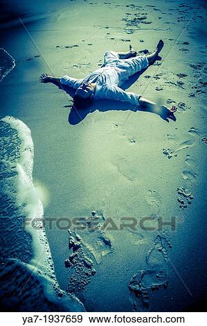Man Lying on Beach View Large Photo Image Stock Photo - Man Lying on Beach. Fotosearch