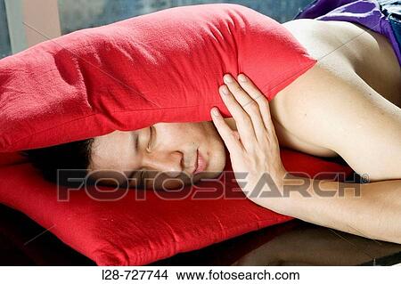 Man lying on bed View Large Photo Image Picture - Man lying on bed. Fotosearch