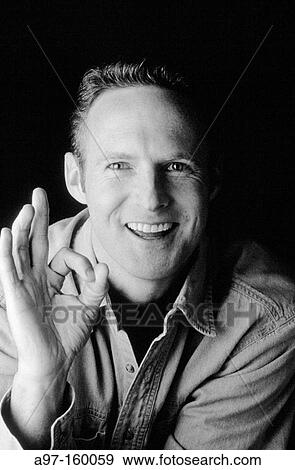 Stock Photo - Man makes okay sign. Fotosearch