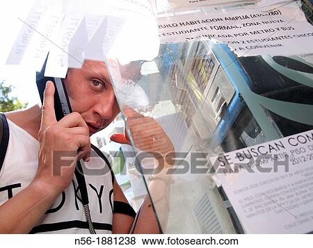 Stock Photo - Man making a phone call. Fotosearch