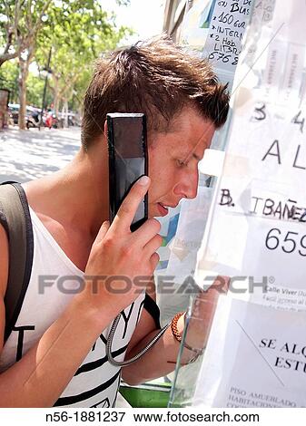 Man making a phone call, Valencia, Spain View Large Photo Image Stock Photo - Man making a phone call, Valencia, Spain. Fotosearch