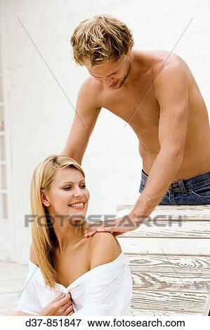 Man massaging a woman at home View Large Photo Image Stock Photo - Man massaging a woman at home. Fotosearch
