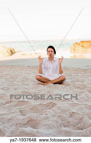 Man Meditating on Beach View Large Photo Image Stock Photo - Man Meditating on Beach. Fotosearch
