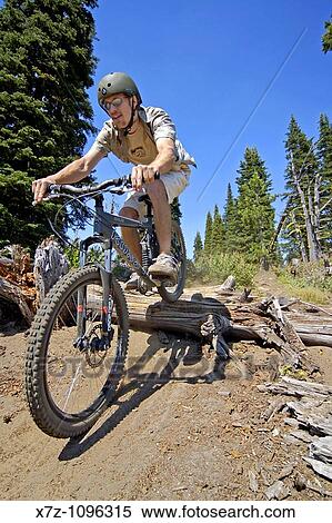Man mountain bikes the steep and difficult Zorro Trail at Brundage Mountain Ski Area near the town of McCall in central Idaho USA View Large Photo Image Stock Photography - Man mountain bikes the steep and difficult Zorro Trail at Brundage Mountain Ski Area near the town of McCall in central Idaho USA. Fotosearch