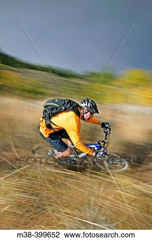 Stock Image - Man mt. biking in Sun Valley, Idaho. USA. Fotosearch