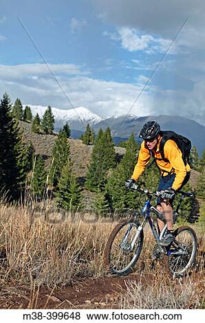 Man mt. biking in Sun Valley, Idaho. USA View Large Photo Image Stock Photo - Man mt. biking in Sun Valley, Idaho. USA. Fotosearch