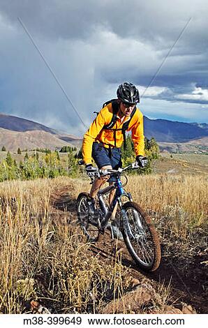 Stock Photo - Man mt. biking in Sun Valley, Idaho. USA. Fotosearch