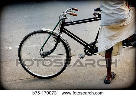 Man on a bicycle waiting, India View Large Photo Image Stock Image - Man on a bicycle waiting, India. Fotosearch