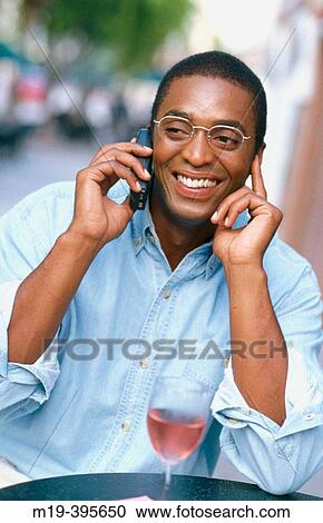 Stock Image - man on a cell phone. Fotosearch