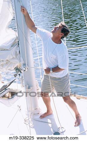 man on a sailboat View Large Photo Image Stock Photography - man on a sailboat. Fotosearch