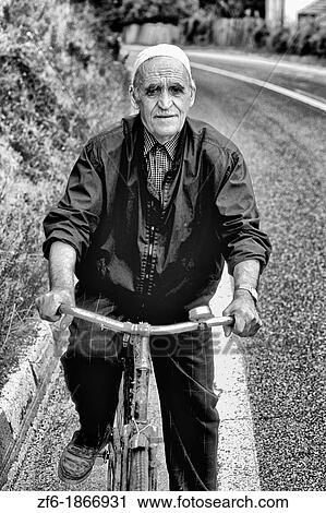 Man on bicycle in Albania near Tirana View Large Photo Image Stock Image - Man on bicycle in Albania near Tirana. Fotosearch