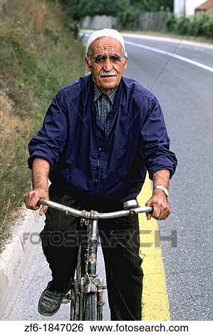 Stock Photograph - Man on bicycle in Albania near Tirana. Fotosearch