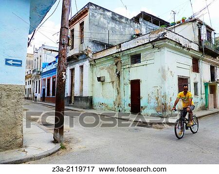 Man on bicycle in the streets of Havana, Cuba. View Large Photo Image Stock Photo - Man on bicycle in the streets of Havana, Cuba.. Fotosearch