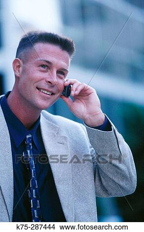 Picture - man on cell phone. Fotosearch