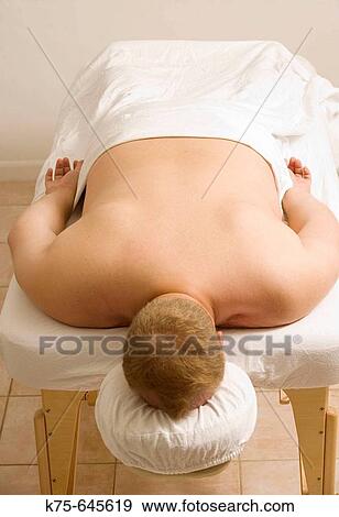 Stock Photo - Man on massage table. Fotosearch