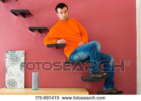 Stock Photography - Man on steps. Fotosearch