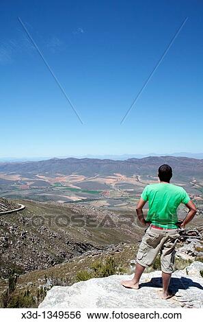 Man on Swartberg Pass, Western Cape, South Africa View Large Photo Image Stock Photograph - Man on Swartberg Pass, Western Cape, South Africa. Fotosearch