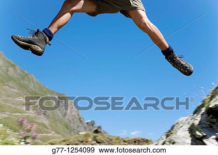 Man on the mountain Italy Piedmont Alps Formazza Valley. View Large Photo Image Stock Photo - Man on the mountain Italy Piedmont Alps Formazza Valley.. Fotosearch