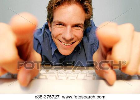 Stock Photo - man online. Fotosearch