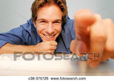 Stock Photograph - man online. Fotosearch