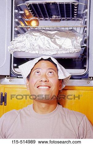 Man, oven and fun View Large Photo Image Stock Photo - Man, oven and fun. Fotosearch