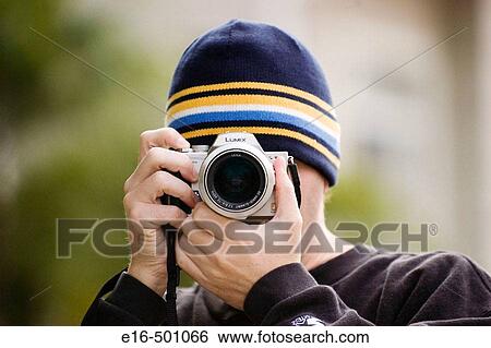Man photographing View Large Photo Image Stock Photograph - Man photographing. Fotosearch