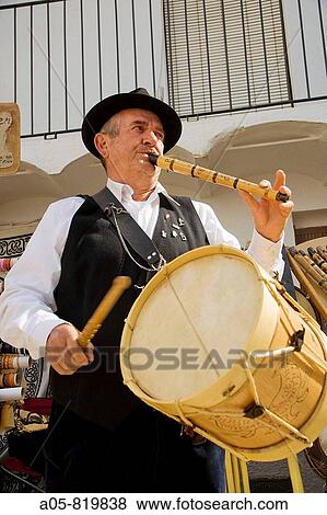 Stock Photo - Man playing drum and Galician bagpipe during the Cerezo en flor festival, Casas del Castaar. Jerte river valley, Caceres province, Extremadura, Spain. Fotosearch